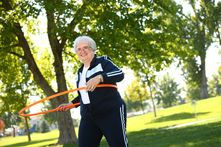 Senior woman with hula hoop