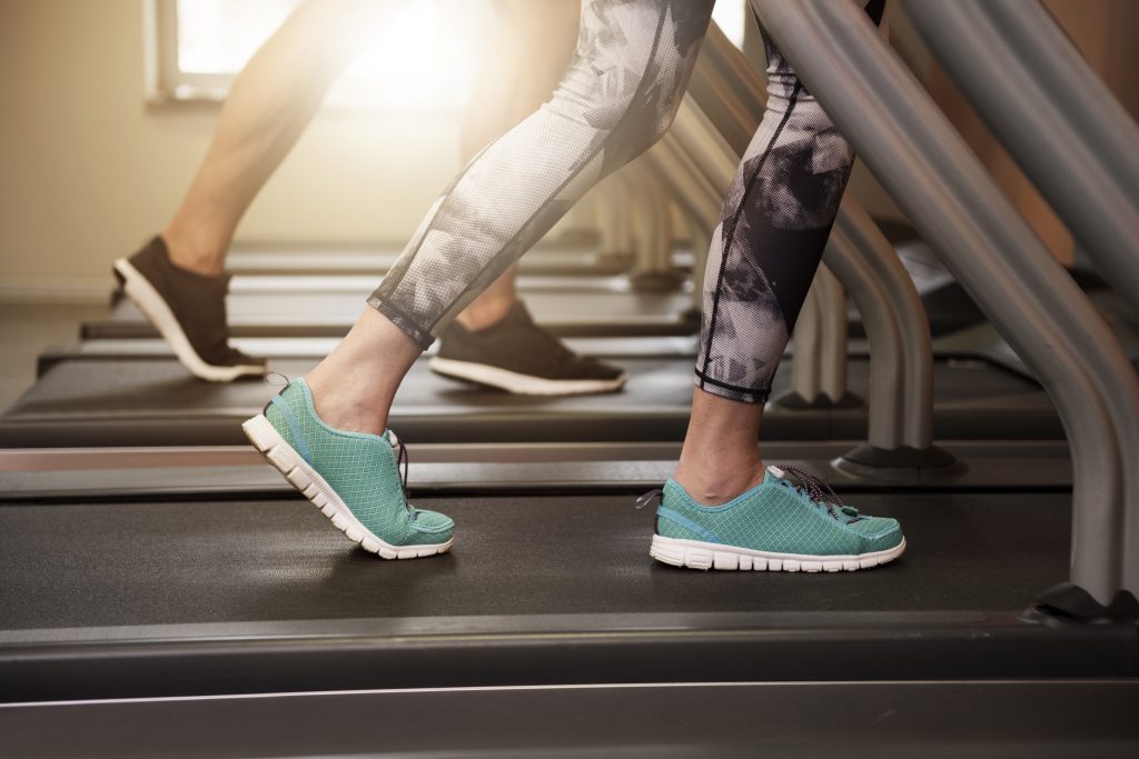 couple walking on treadmill