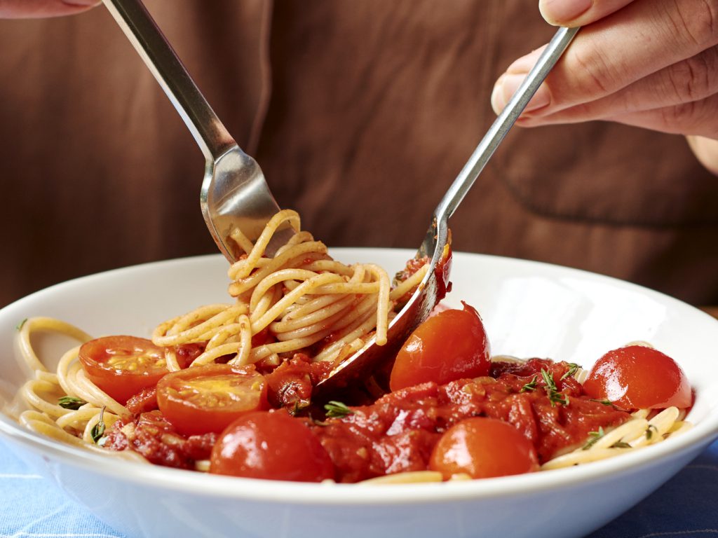 bowl of spaghetti with tomatoes