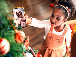 granddaughter on video call with grandparents