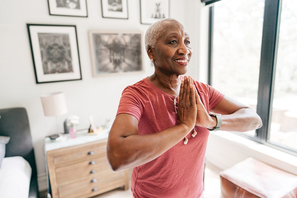 older woman doing yoga