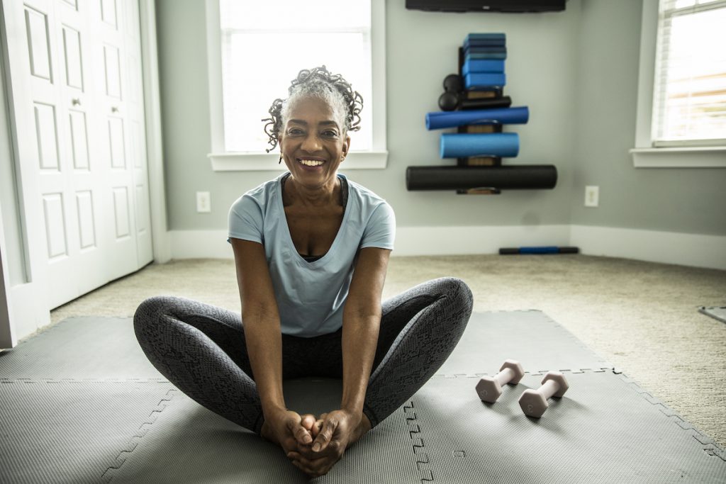 Senior woman exercising in home gym