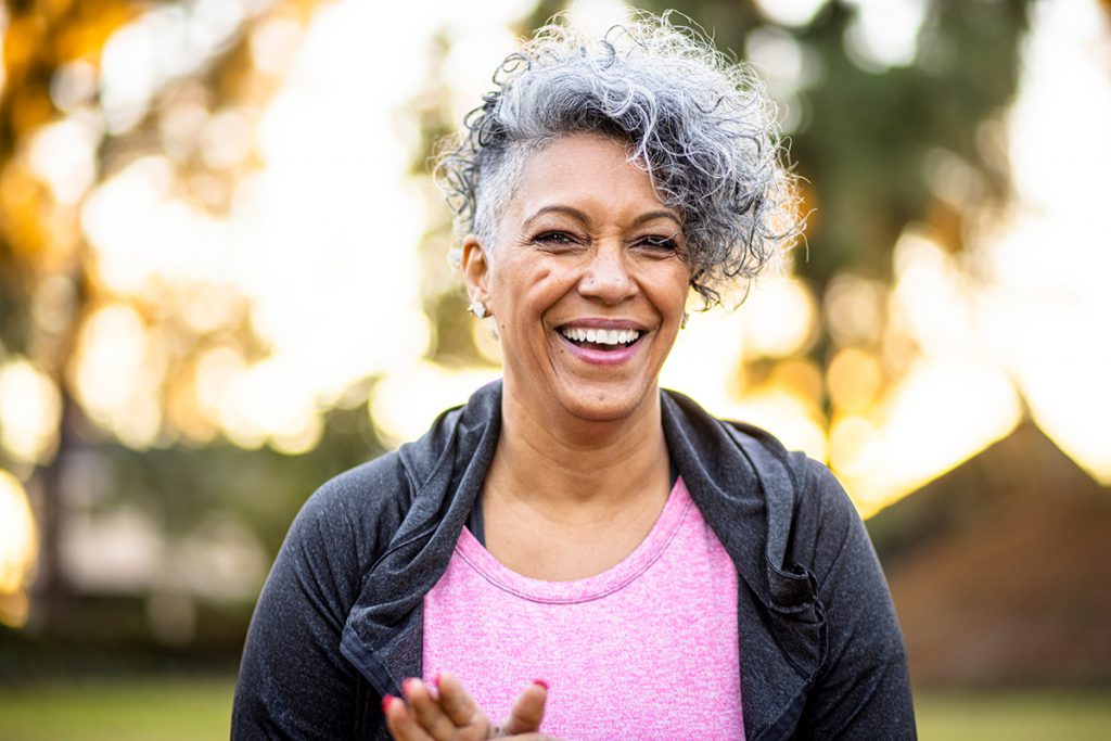 smiling active senior woman for a story on surprising health benefits of losing 10 pounds