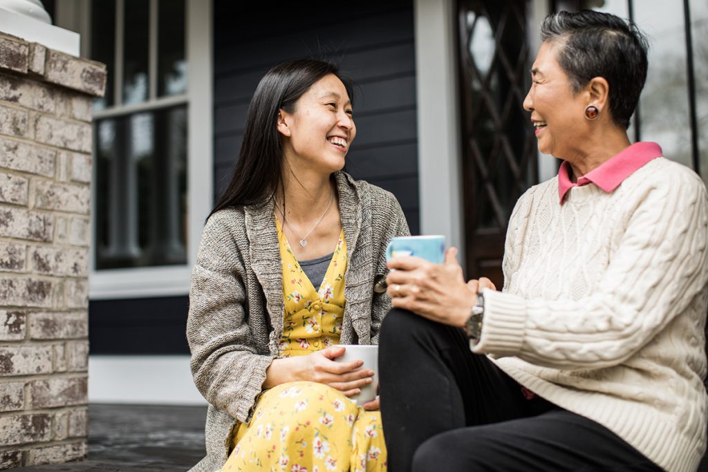 older woman and adult daughter talking on their porch for a story on do I need a health care proxy